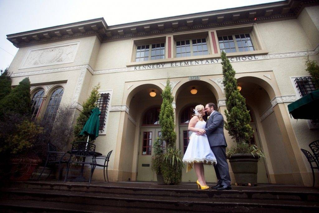 date idea: married couple kissing outside Kennedy School Theater