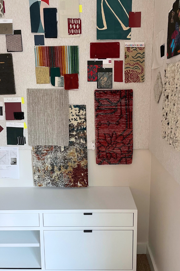 the interior of a design studio with mood board on the wall