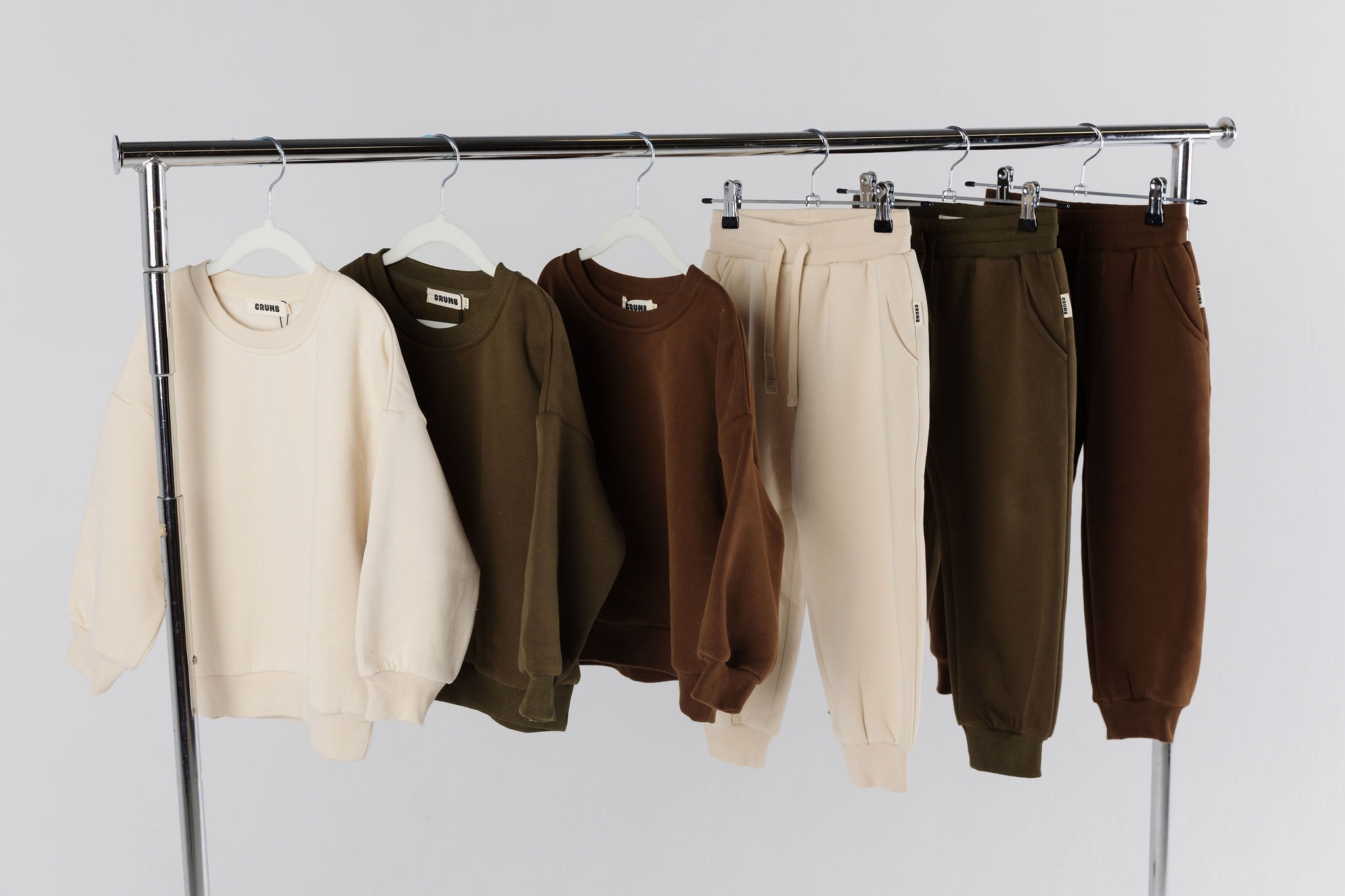 Clothes rack showcasing kids clothes. Practical fashion for children. Oversized Downtown Set.