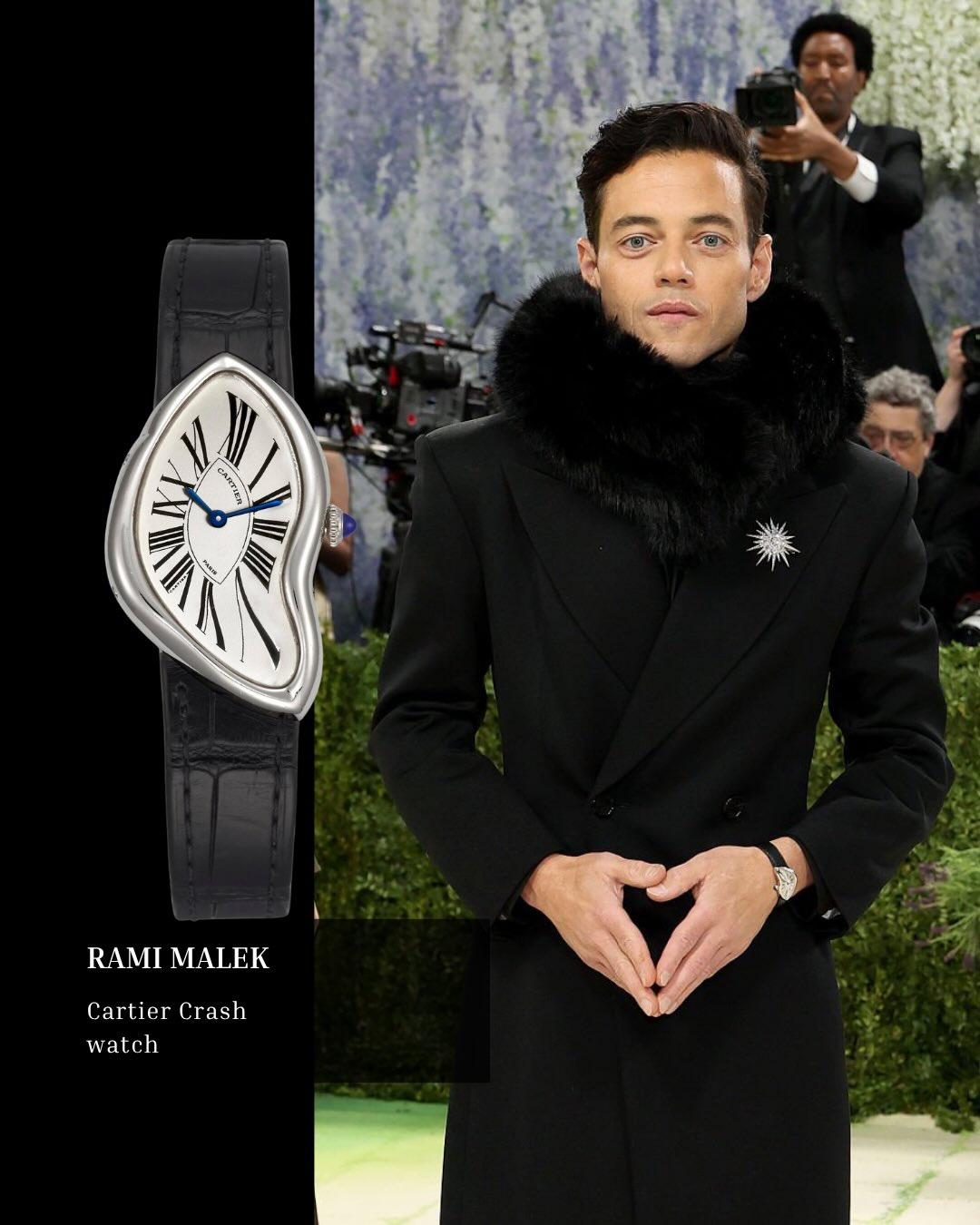 Rami Malek memakai Cartier Crash 1992 platinum di Met Gala 2026 dengan case asimetris dan strap kulit hitam.