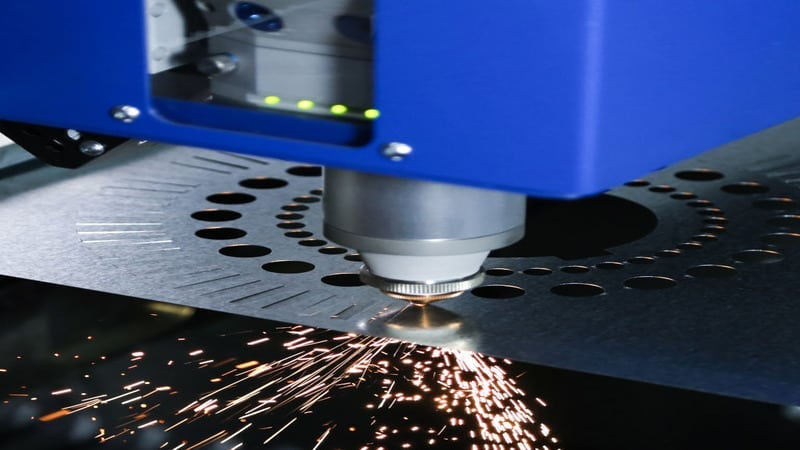 Laser machine starts cutting stencils.