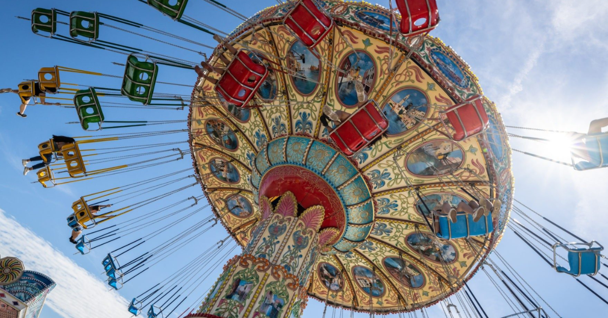 Classic swing carousel ride at the Point Pleasant Beach boardwalk, steps from vacation rentals on ShoreSummerRentals.com — families enjoy Jenkinson's amusement rides all summer long
