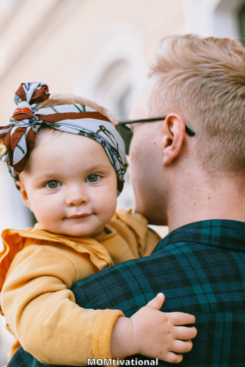 Cute baby boy in Father's arms