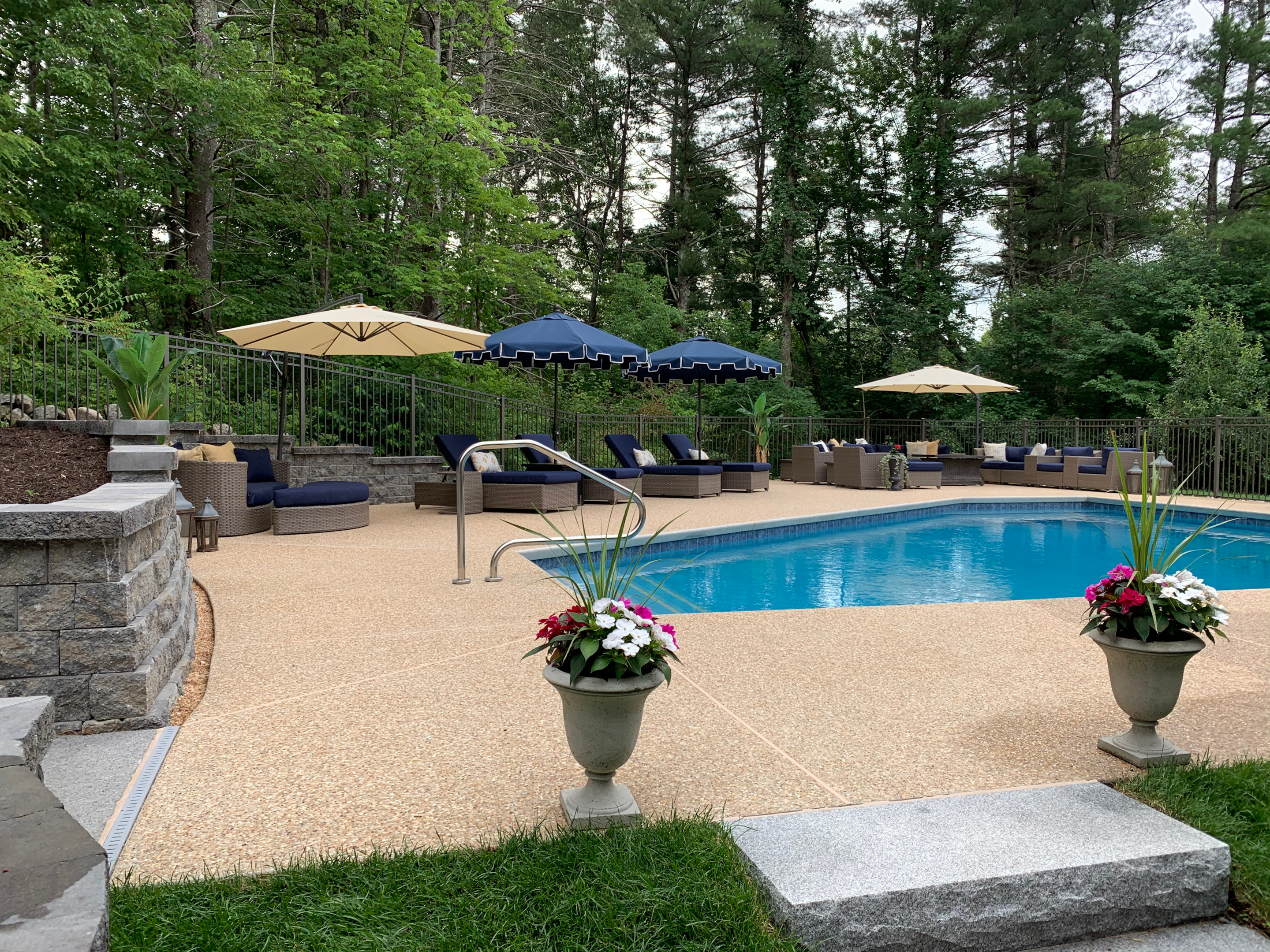 Stamped concrete pool deck resembling natural materials