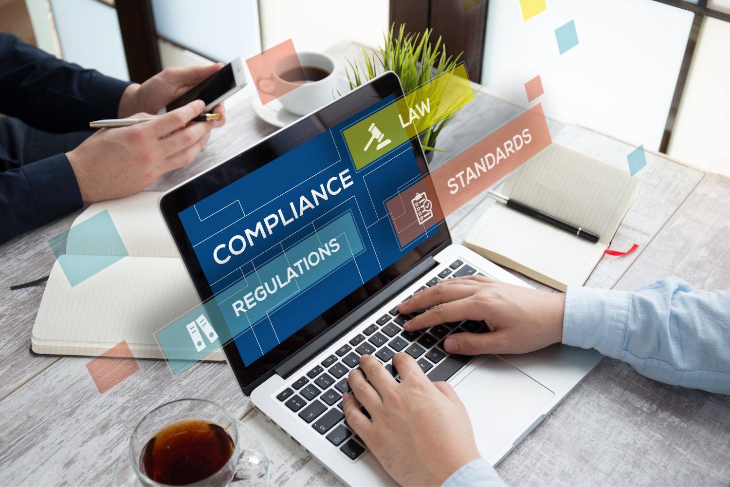 A compliance guide open on a laptop.