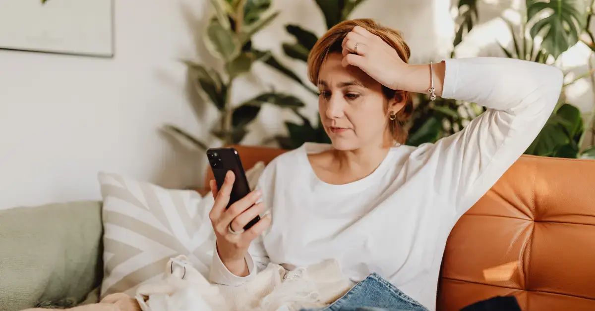 Woman reading an IRS audit notice while learning what happens if you get audited and don't have receipts.