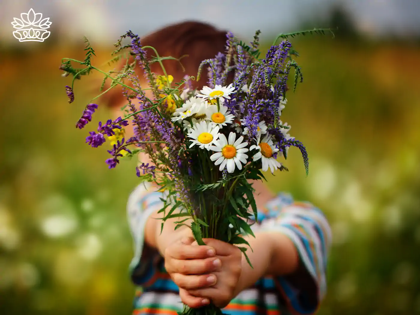 Child presenting a colourful bouquet of wildflowers, symbolising affordable luxury with flower bouquets under R500, delivered with heart by Fabulous Flowers and Gifts.