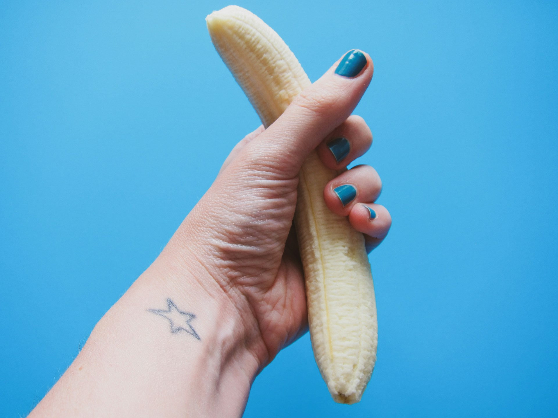 https://unsplash.com/photos/person-holding-peeled-banana-fruit-WlB1xhXAYOc