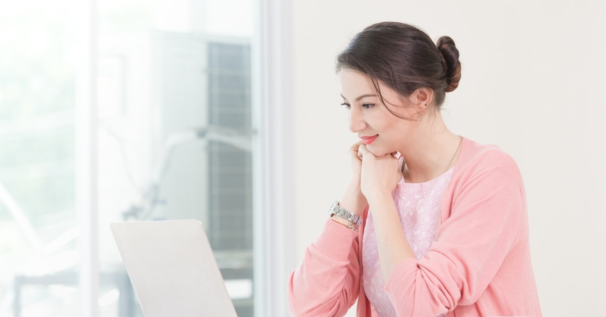 Woman using online CPA services on her laptop, focusing on tax preparation and financial planning.