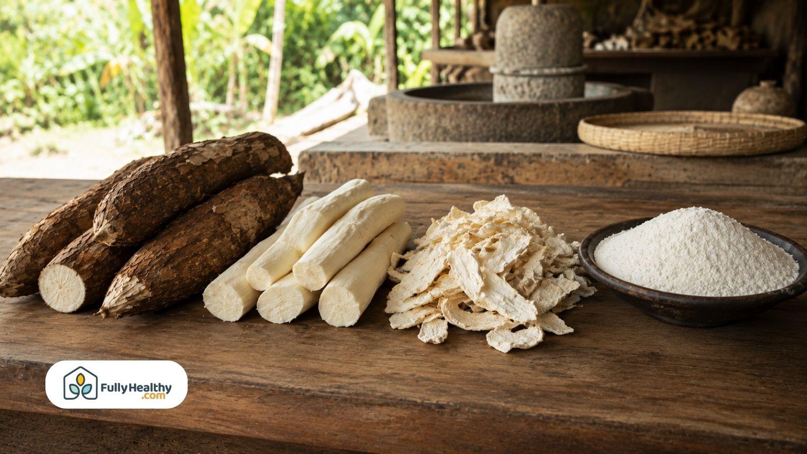 Cassava roots peeled pieces dried flakes and flour on wooden table