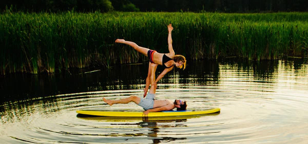 Paddle boarding the Glide Lotus yoga sup. Solid board with weight capacity for two sup yogis no red paddle can handle this.