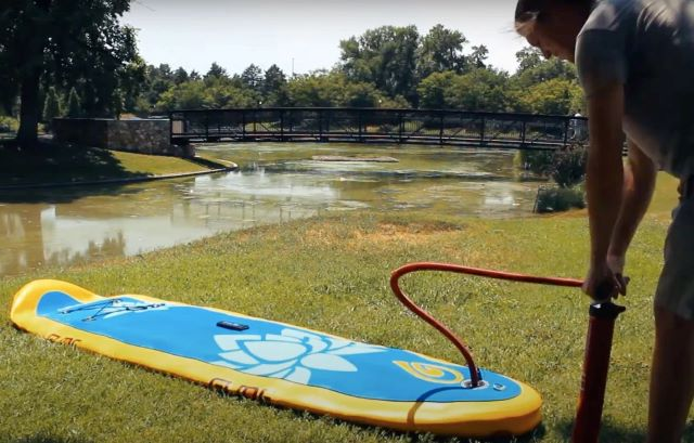 pumping up an inflatable paddle board