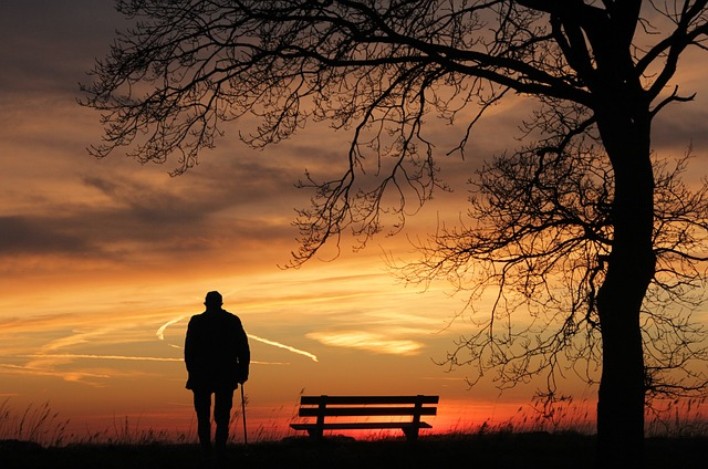 Man reflecting while watching the sunset