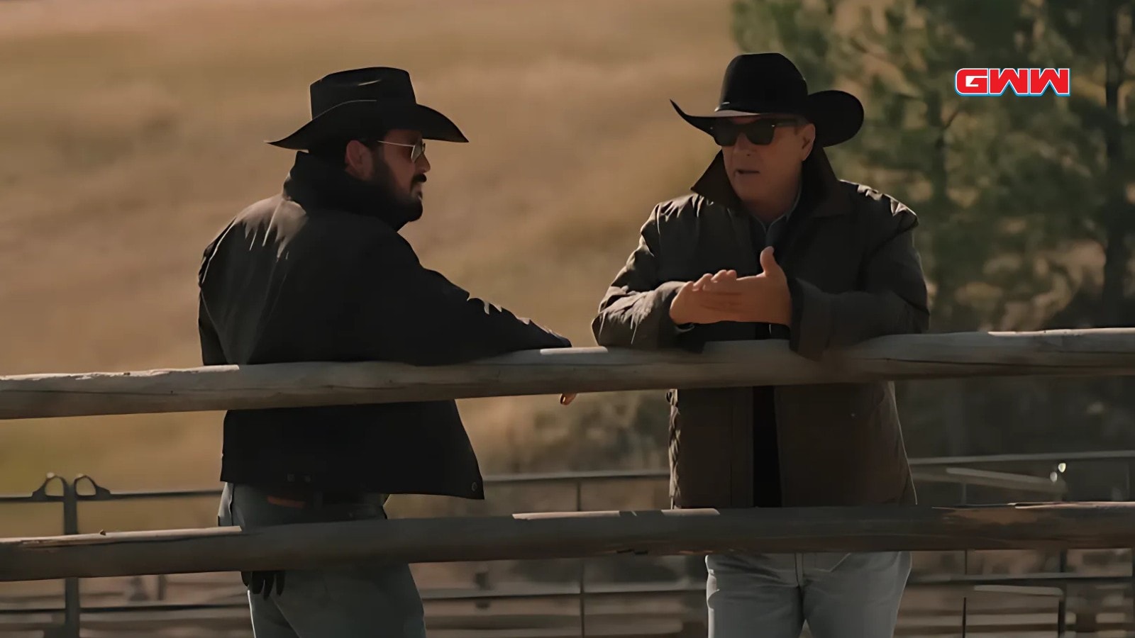 Kevin Costner and Cole Hauser discuss ranch issues at the fence