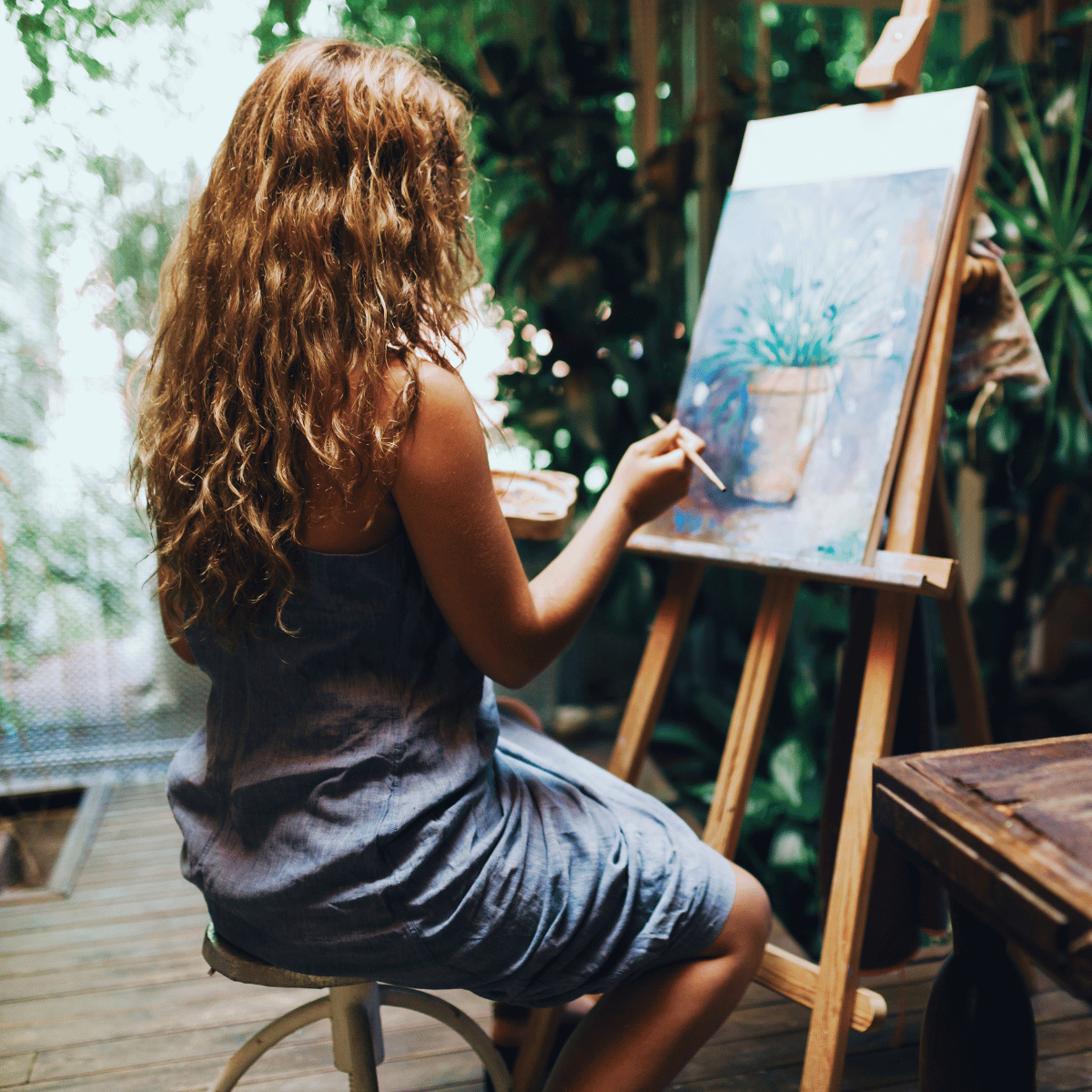 Woman painting - Featured In: How To Stop Overthinking After Being Cheated On