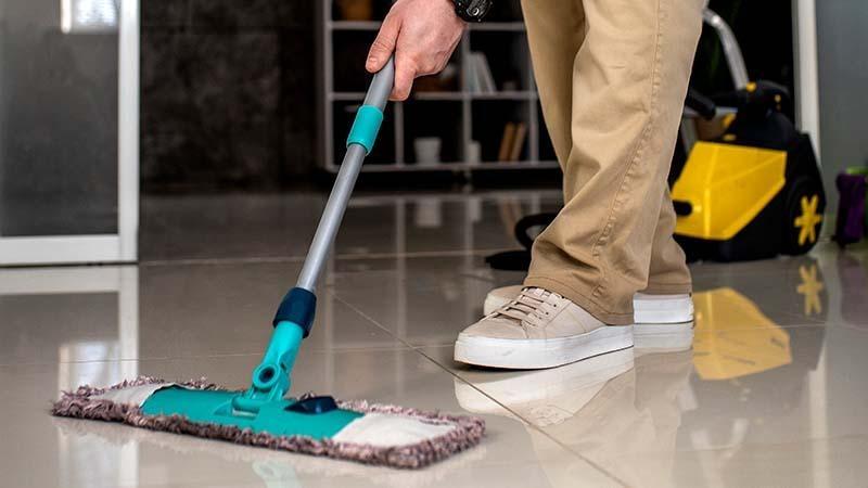 A flat mop on tile floor