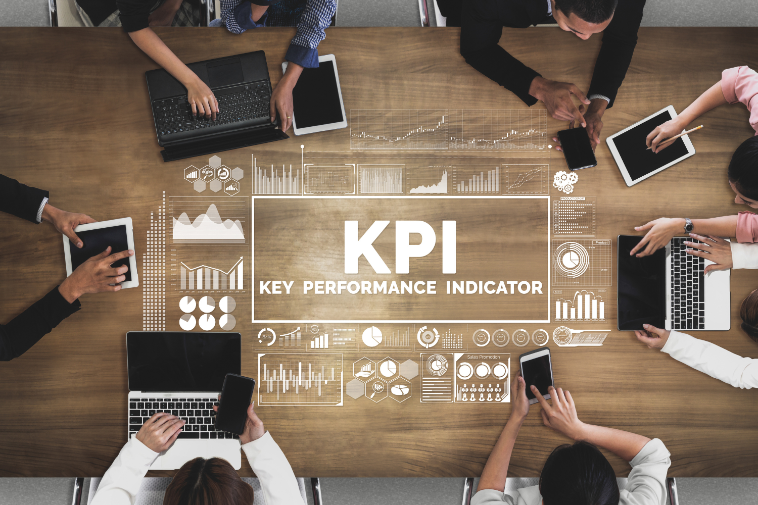 A meeting table with a digital illustration of KPI in the middle.