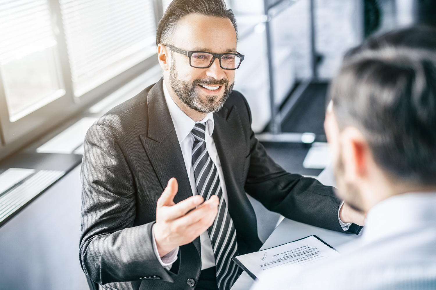 Smiling broker with client.
