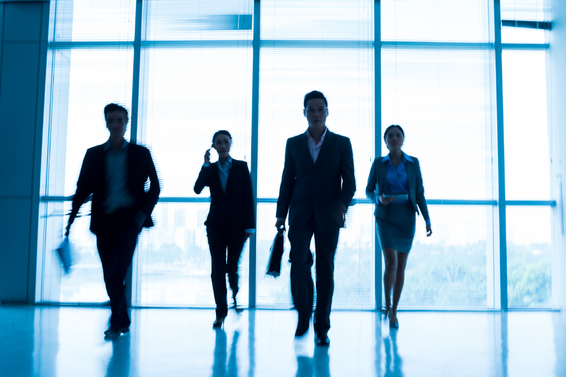 Supplement manufacturer leadership team walking through corporate headquarters