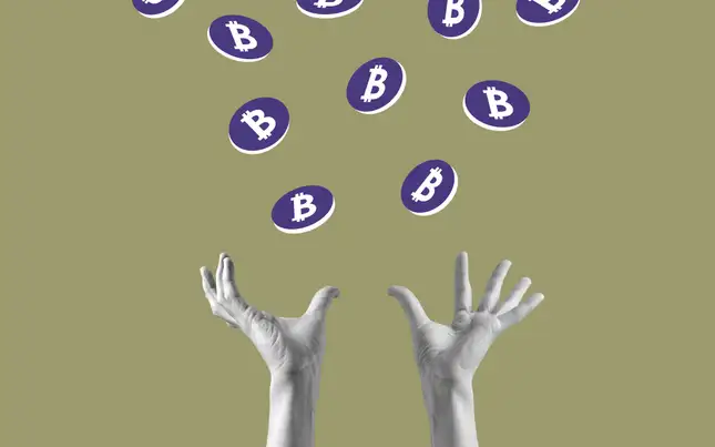 An image reflecting 2 hands throwing up multiple Bitcoin coins in the air. 