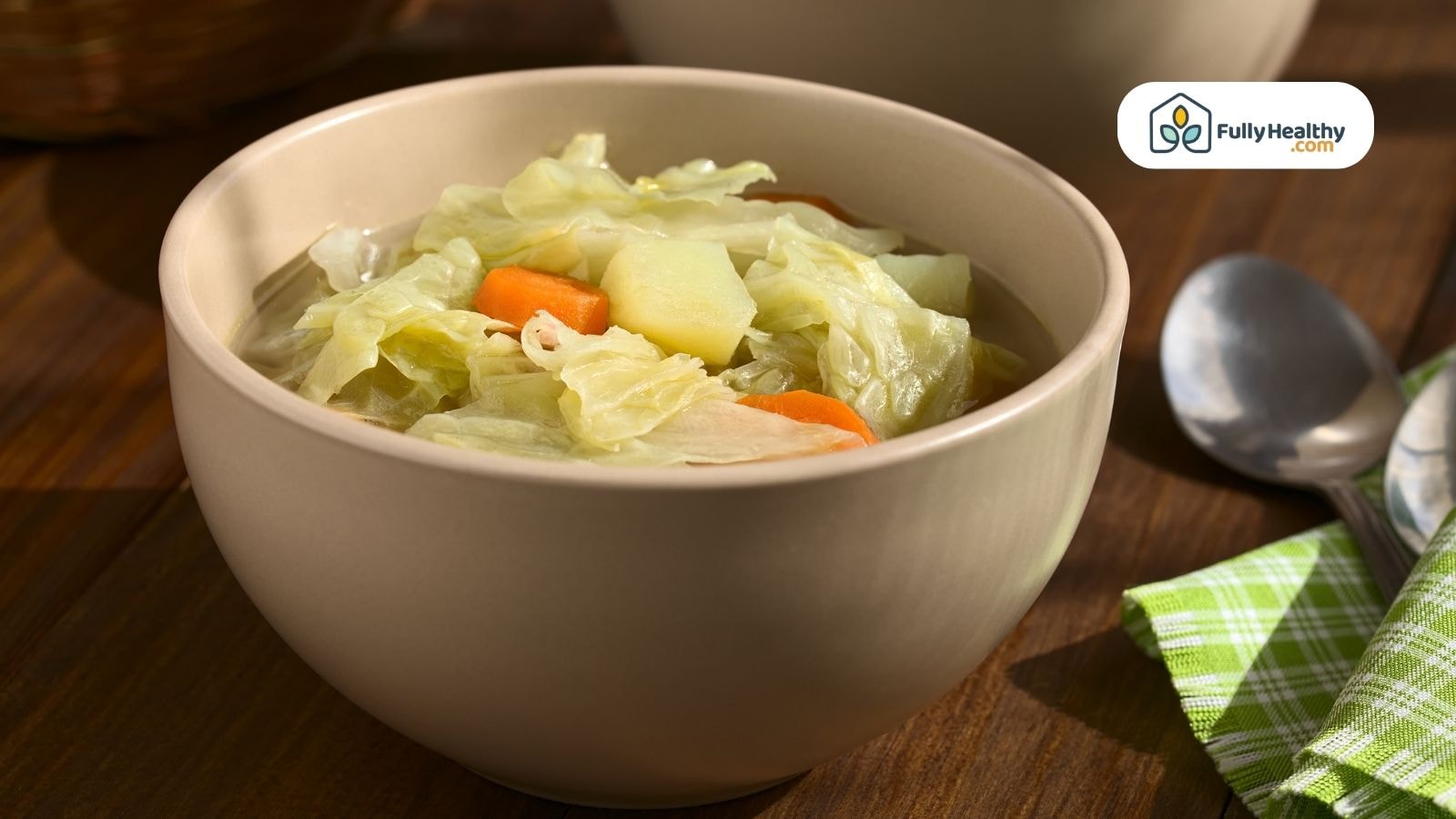 Warm bowl of cabbage soup with carrots and potatoes