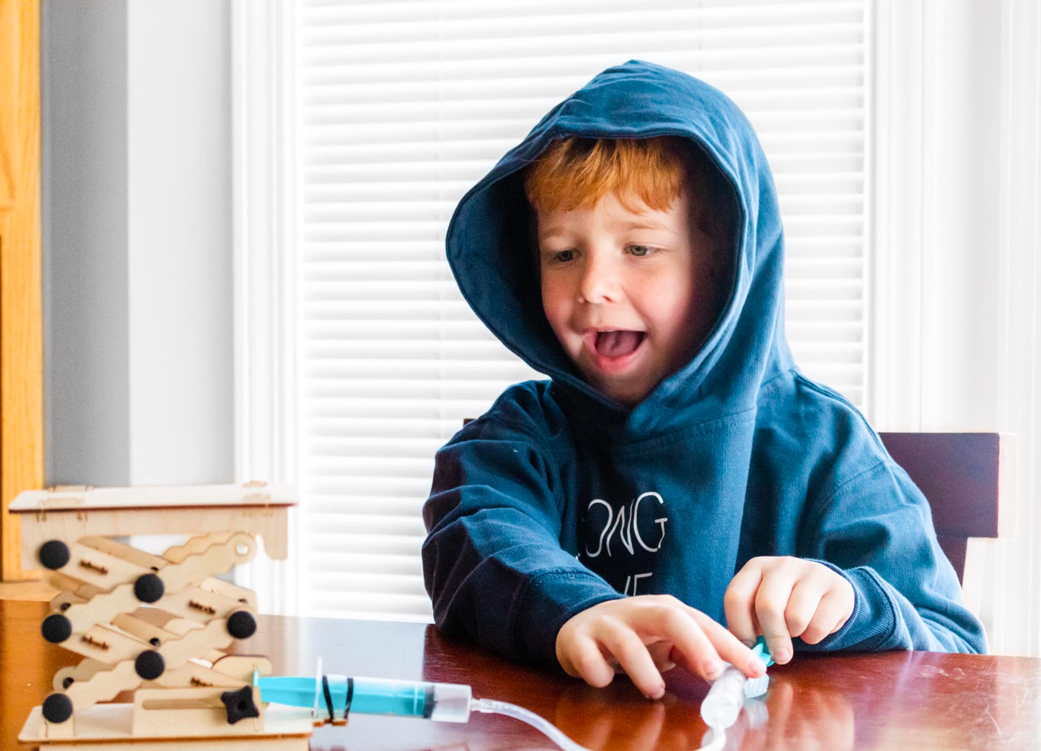 A child conducting experiments with a science kit