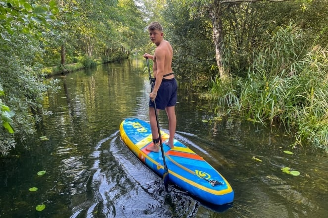 paddling an inflatable stand up paddle board