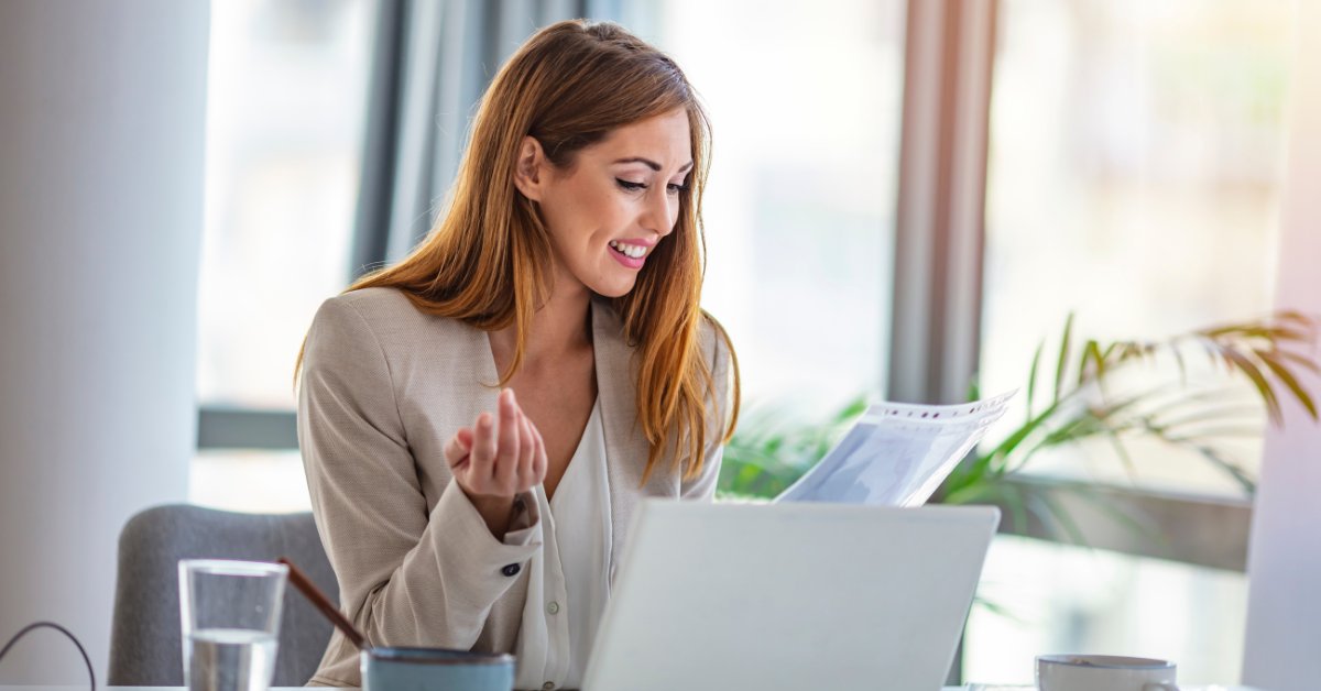 Woman reviewing her OnlyFans free trial conversion stats and subscriber growth on her dashboard.
