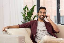 Happy Man Calling On Smartphone At Home Stock Photo, Picture And Royalty  Free Image. Image 92341094.