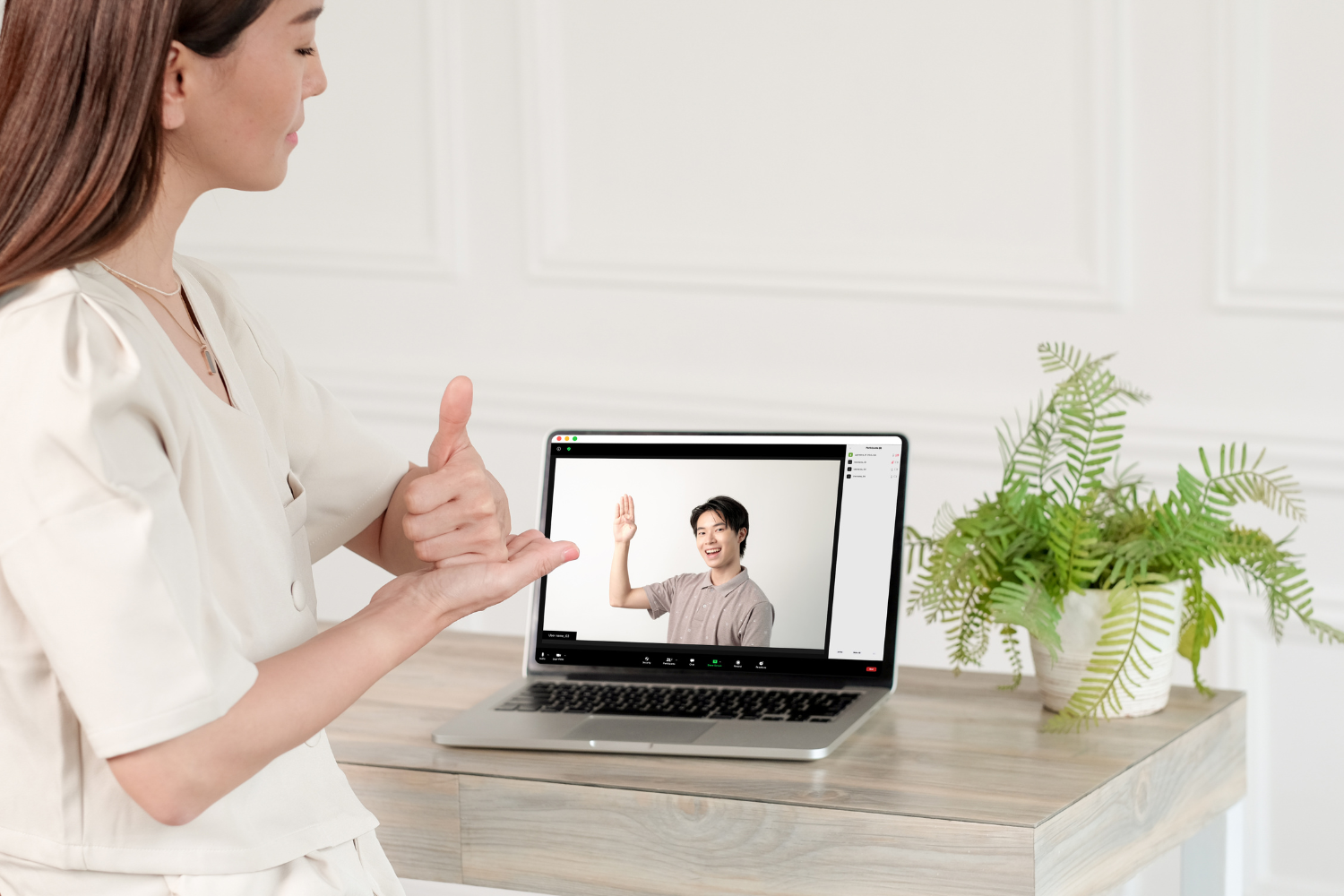 An interviewer and a Filipino candidate building rapport over small talk.