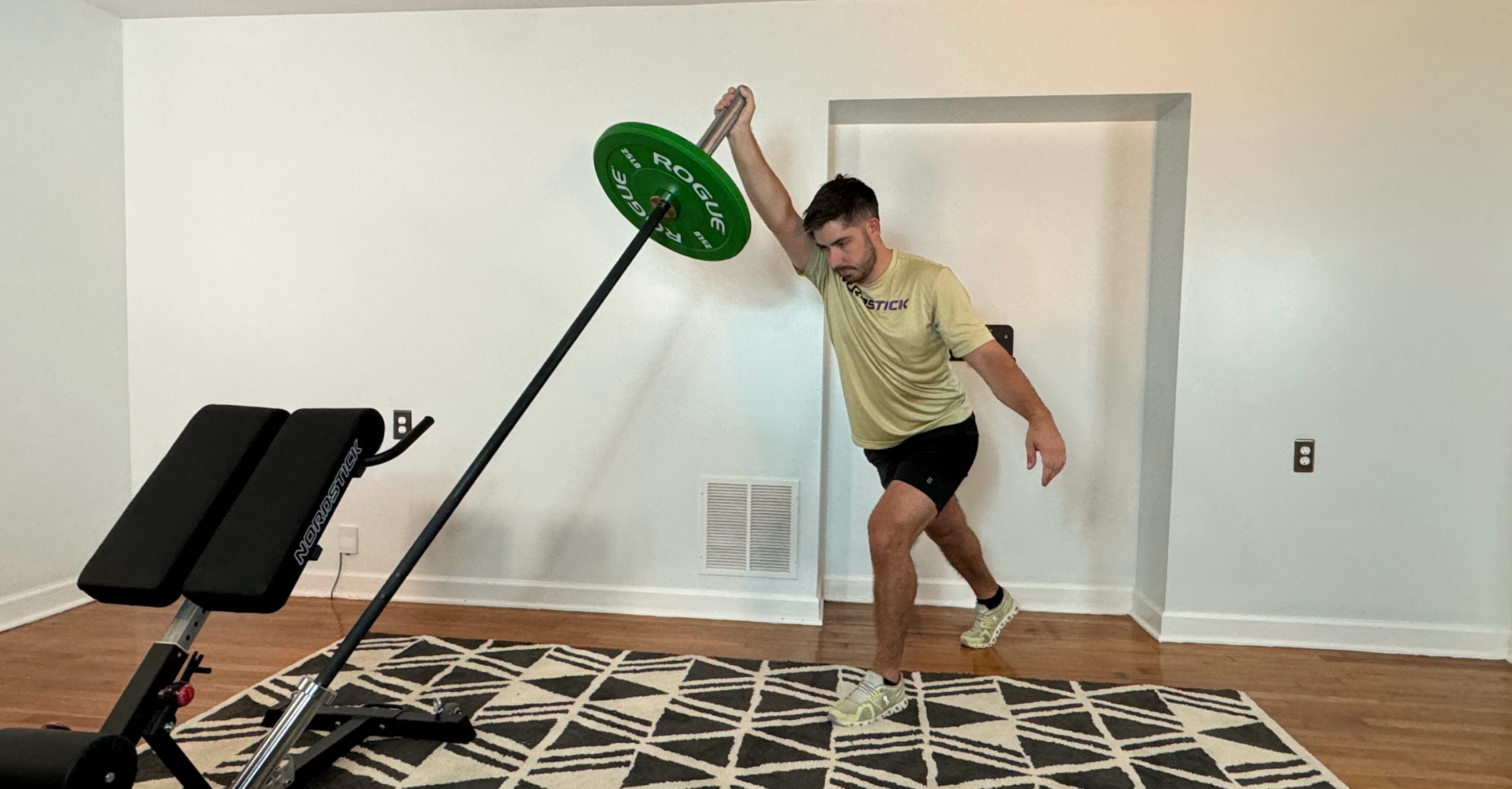 The NordBench is a compact nordic bench that brings in more exercise possibilities to your living room. Upper body workouts like this landmine single-arm press can really help you build muscle and strength without leaving home.