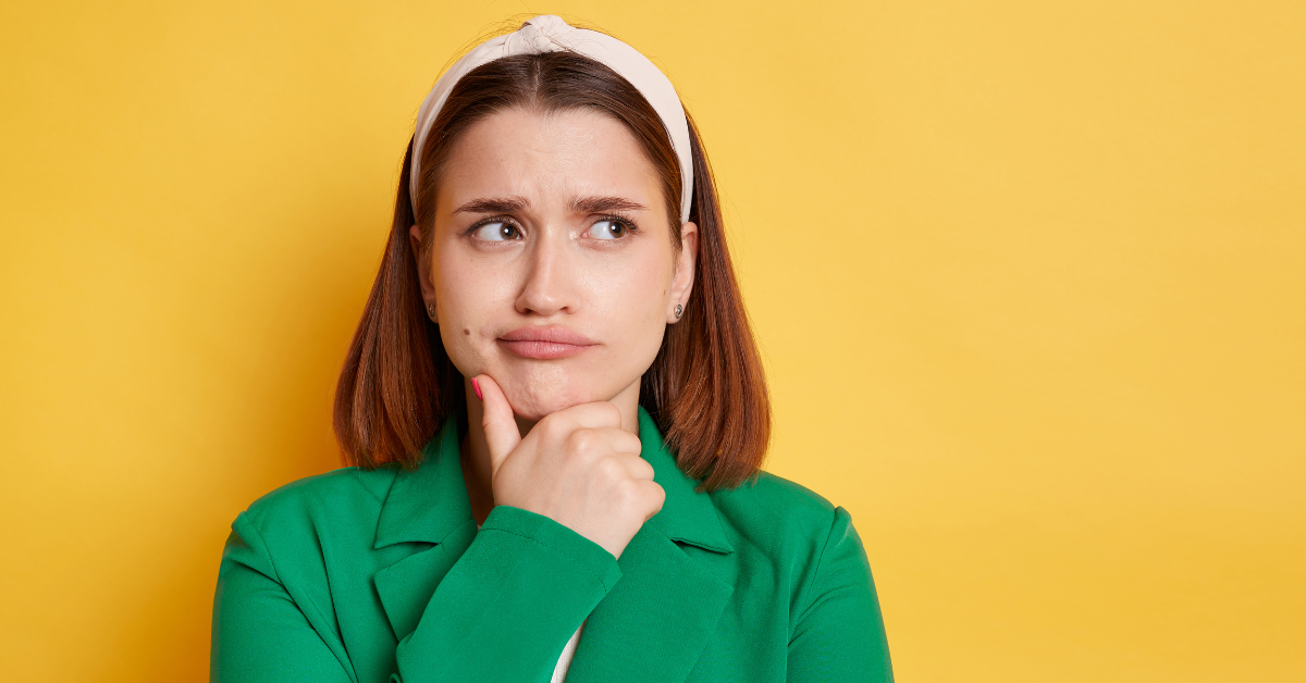  Woman thinking about how to calculate home office deduction for OnlyFans