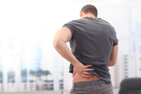 Image of a man dealing with a herniated disc injury