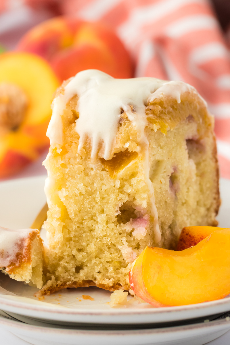 slice of peach cobbler pound cake with bite missing