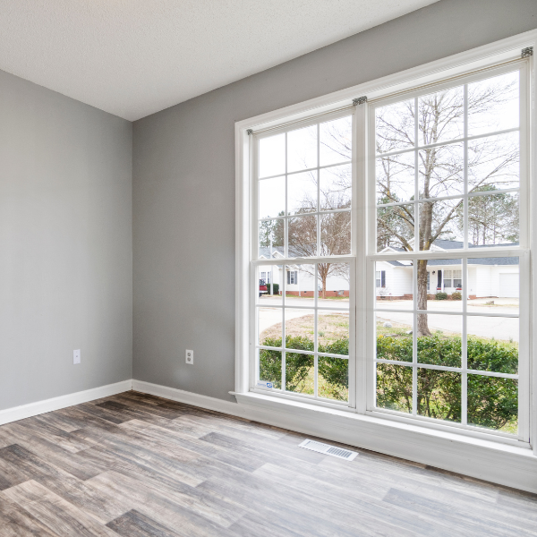 Image showing a homeowner enjoying their newly installed windows in San Antonio.