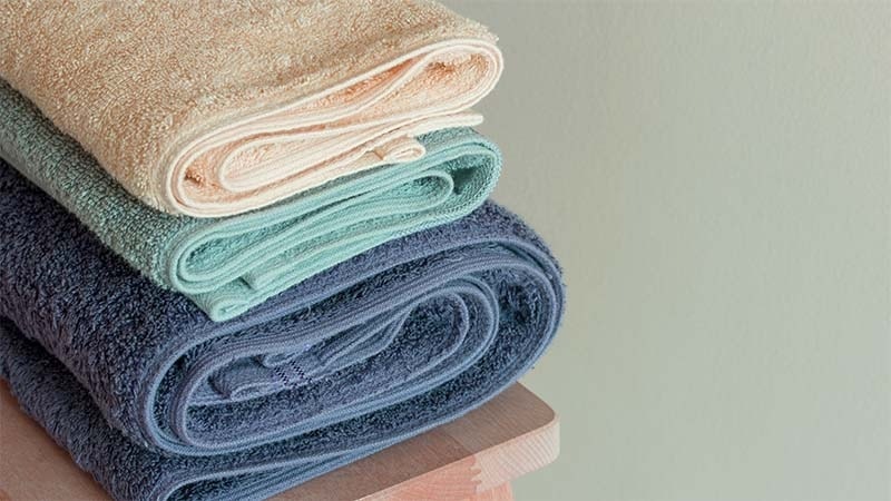 Low GSM towels on top of a high GSM towel