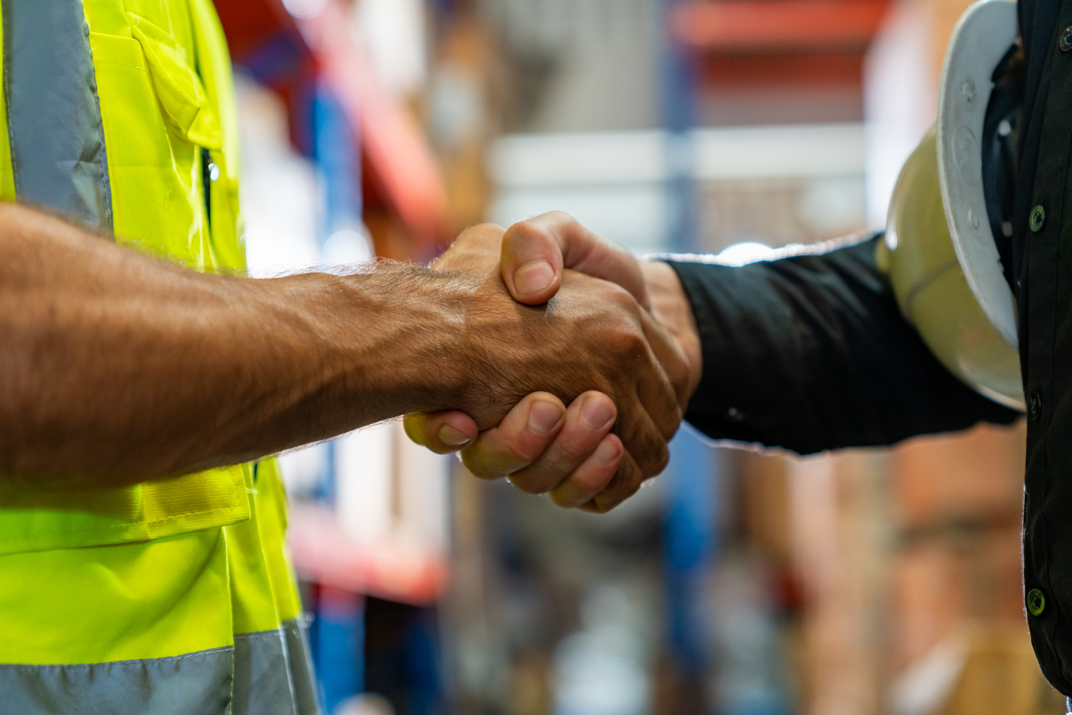 Contractor and engineer shaking hands