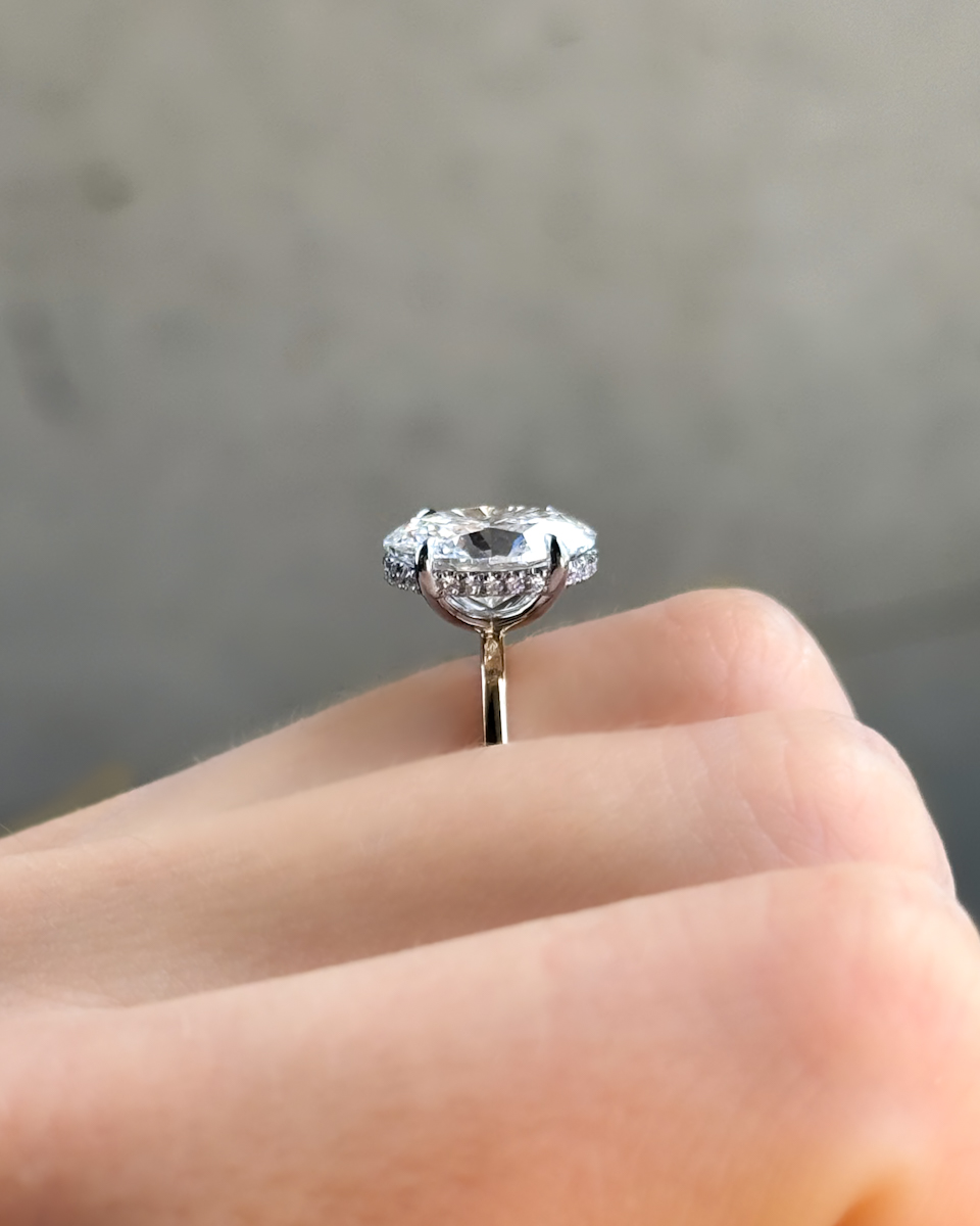 GOODSTONE Thin + Simple Solitaire Engagement Ring With Oval Cut Diamond with a hidden halo