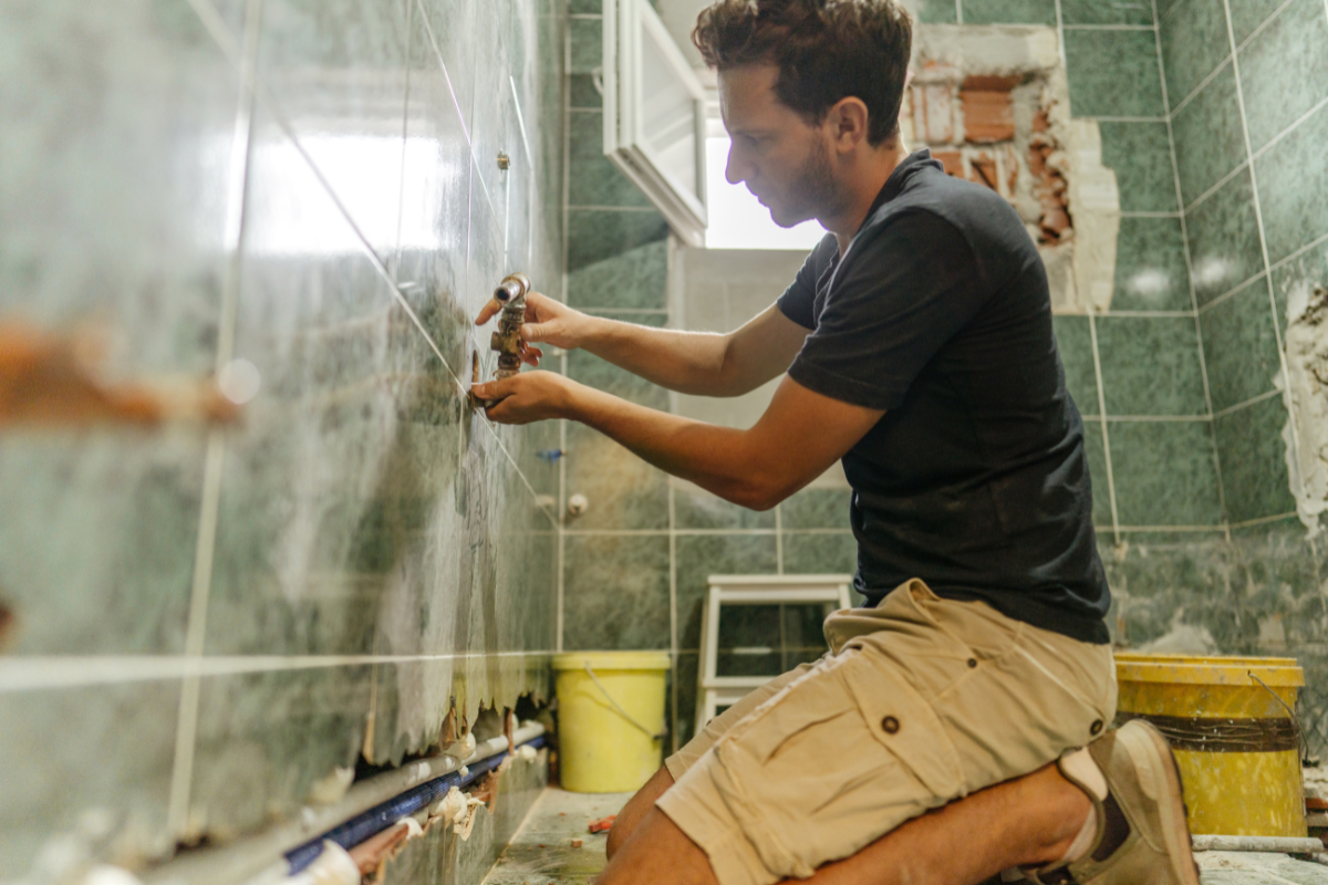 An illustration of various DIY tile projects being executed in a small bathroom, highlighting small bathroom remodel ideas.