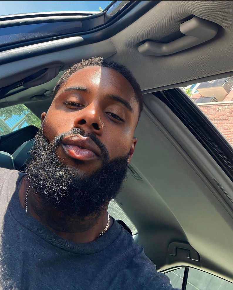 A black man with a beard style