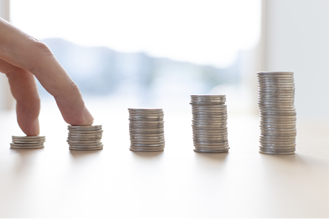 Stacked coins symbolizing salary growth and cost of living in the Philippines