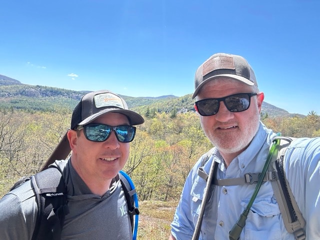 Hikers posing for a selfie at Salt Rock Overlook in Panthertown Valley North Carolina