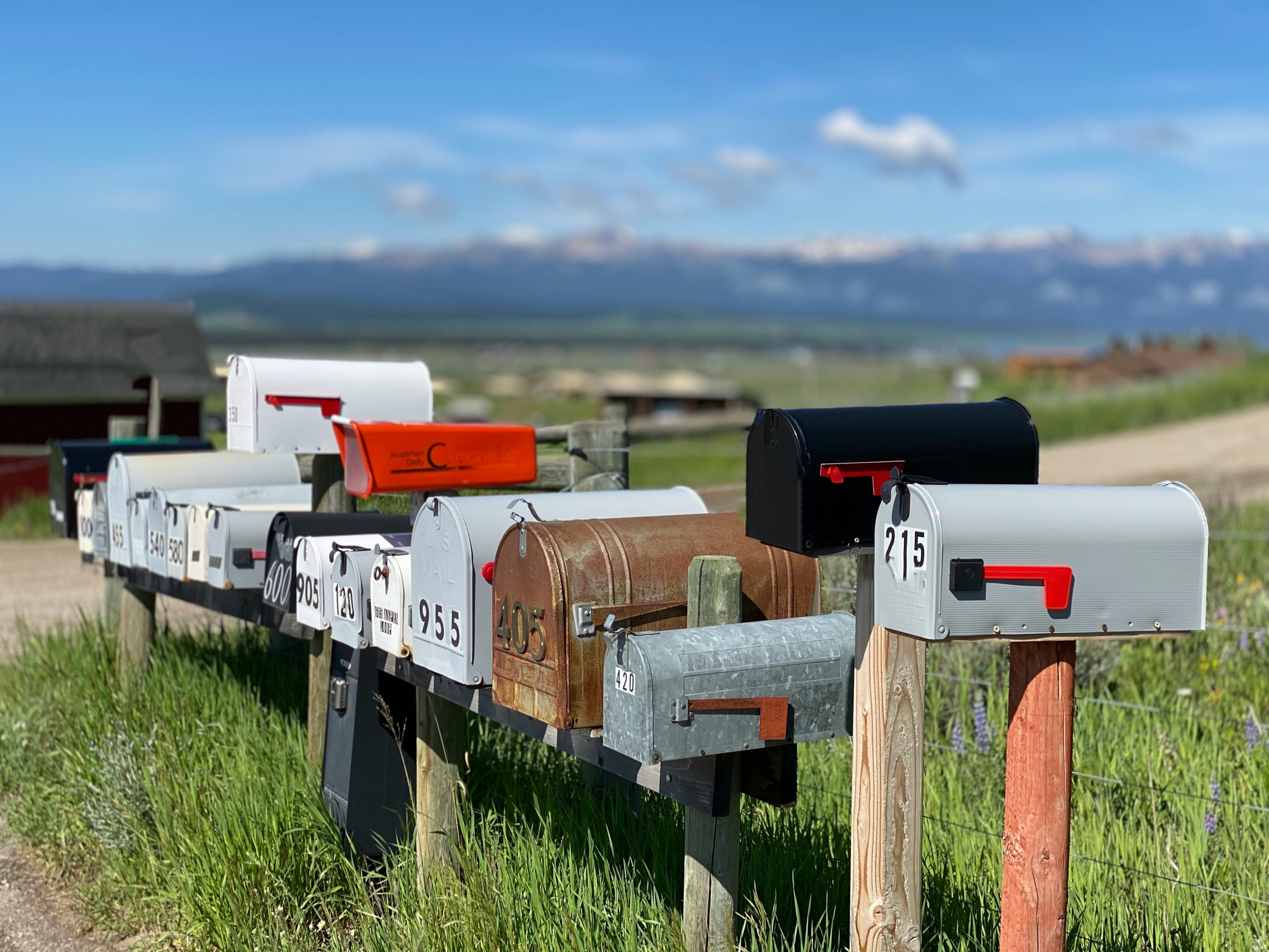 Row of mailboxes that received direct mail as a part of a marketing campaign by a real estate investor.