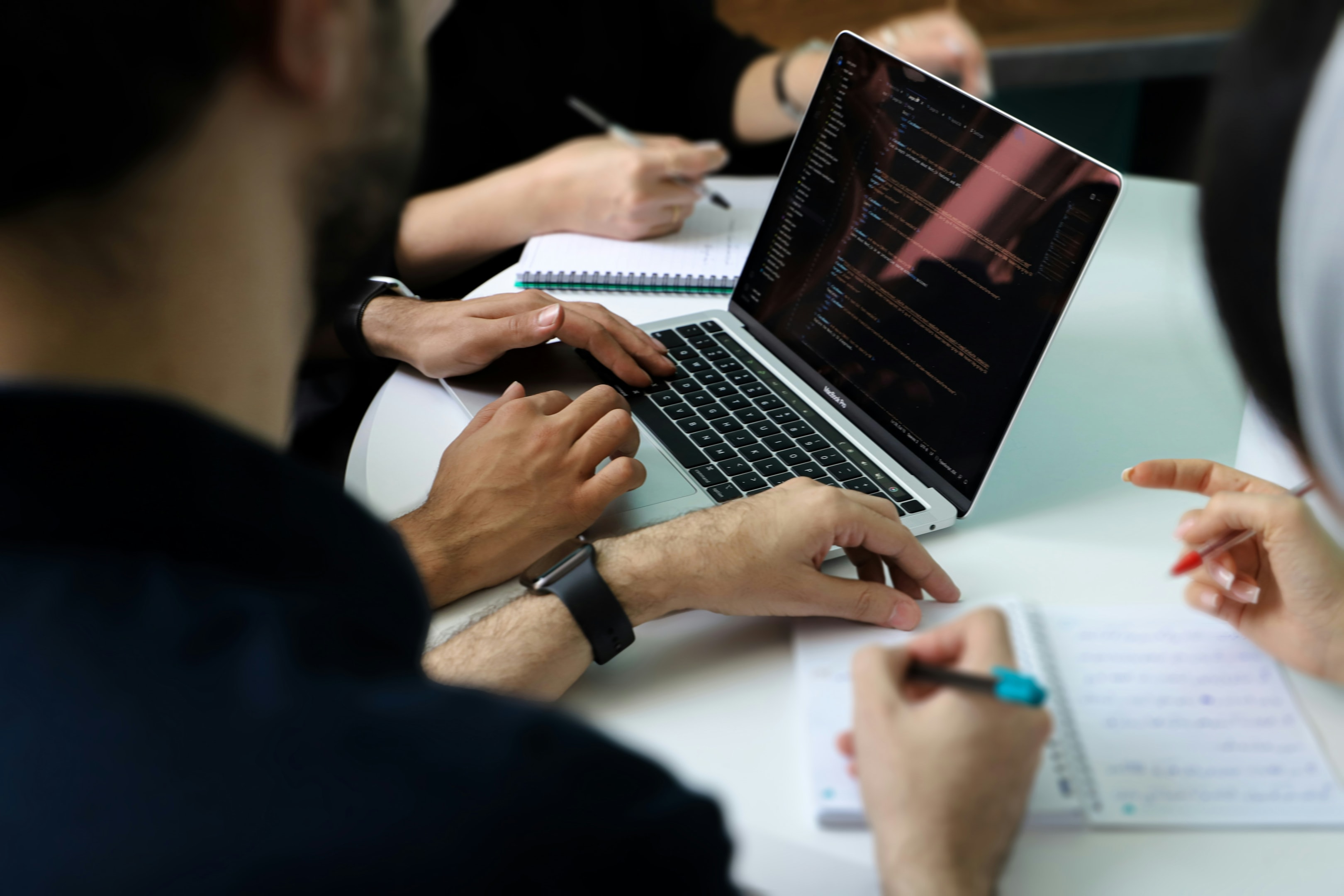 Team of real estate investors meets to look over seasonal trends as they map out their yearly plan. 