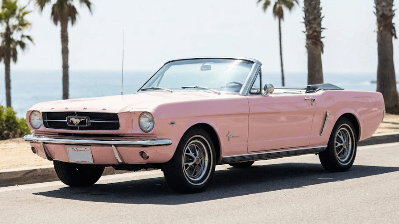 a car in pink car wrap 