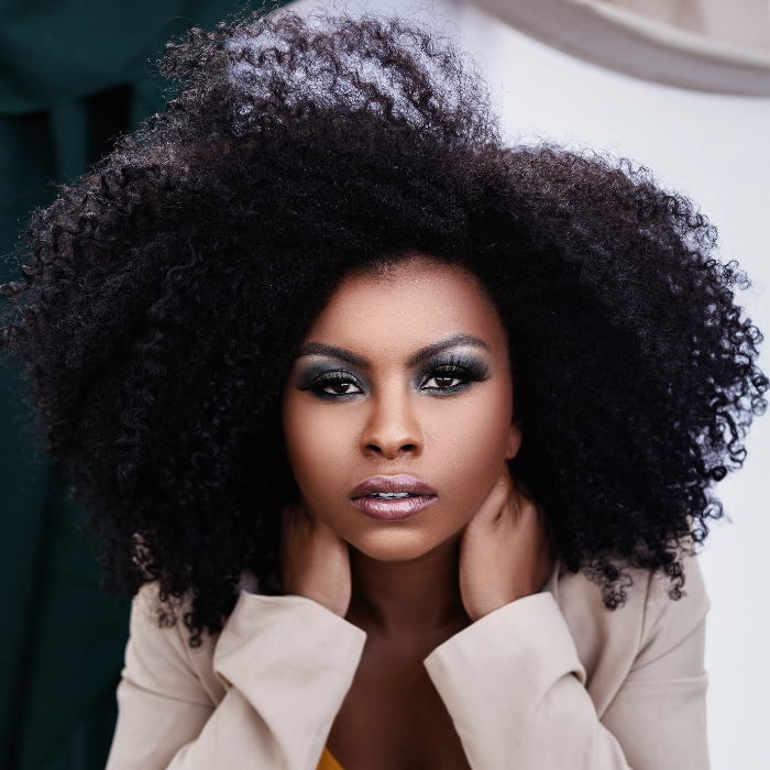 A woman with low porosity hair, enjoying the benefits of deep conditioning