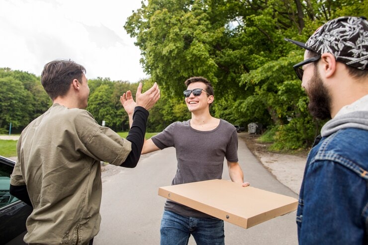 group of friends with a pizza