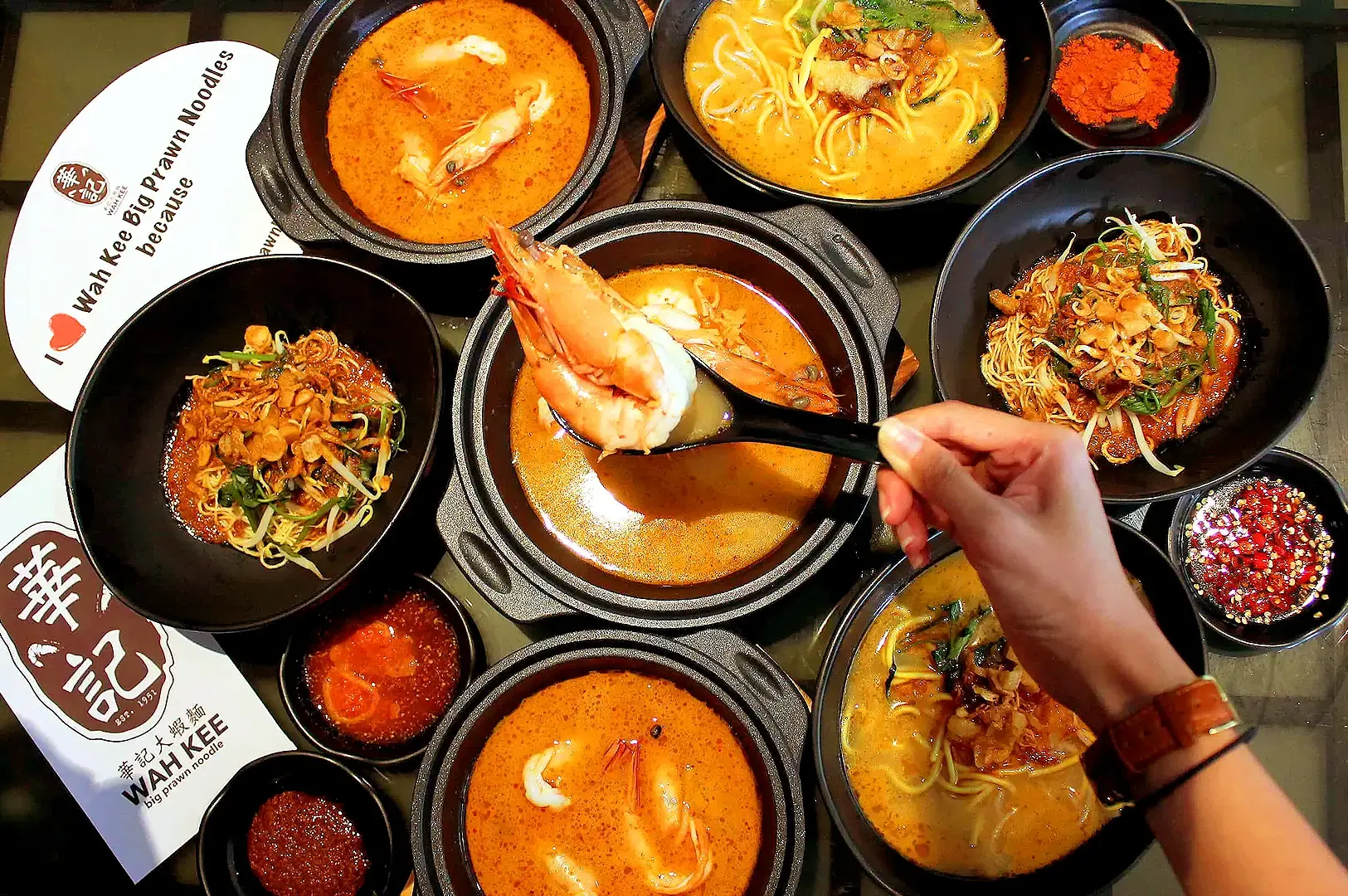 Wah Kee Big Prawn Noodles Singapore spread of prawn mee bowls with jumbo prawns and spicy chilli sauces