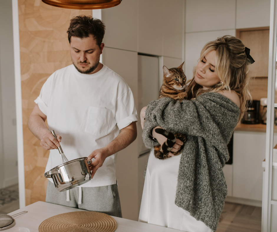 foodie fall date ideas include baking together like this couple and their cat