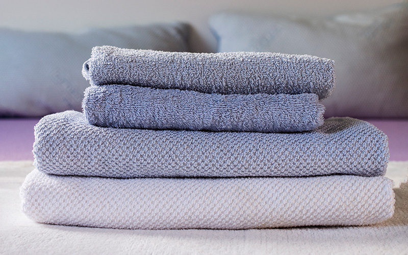 Low GSM towels set on top of high GSM towels